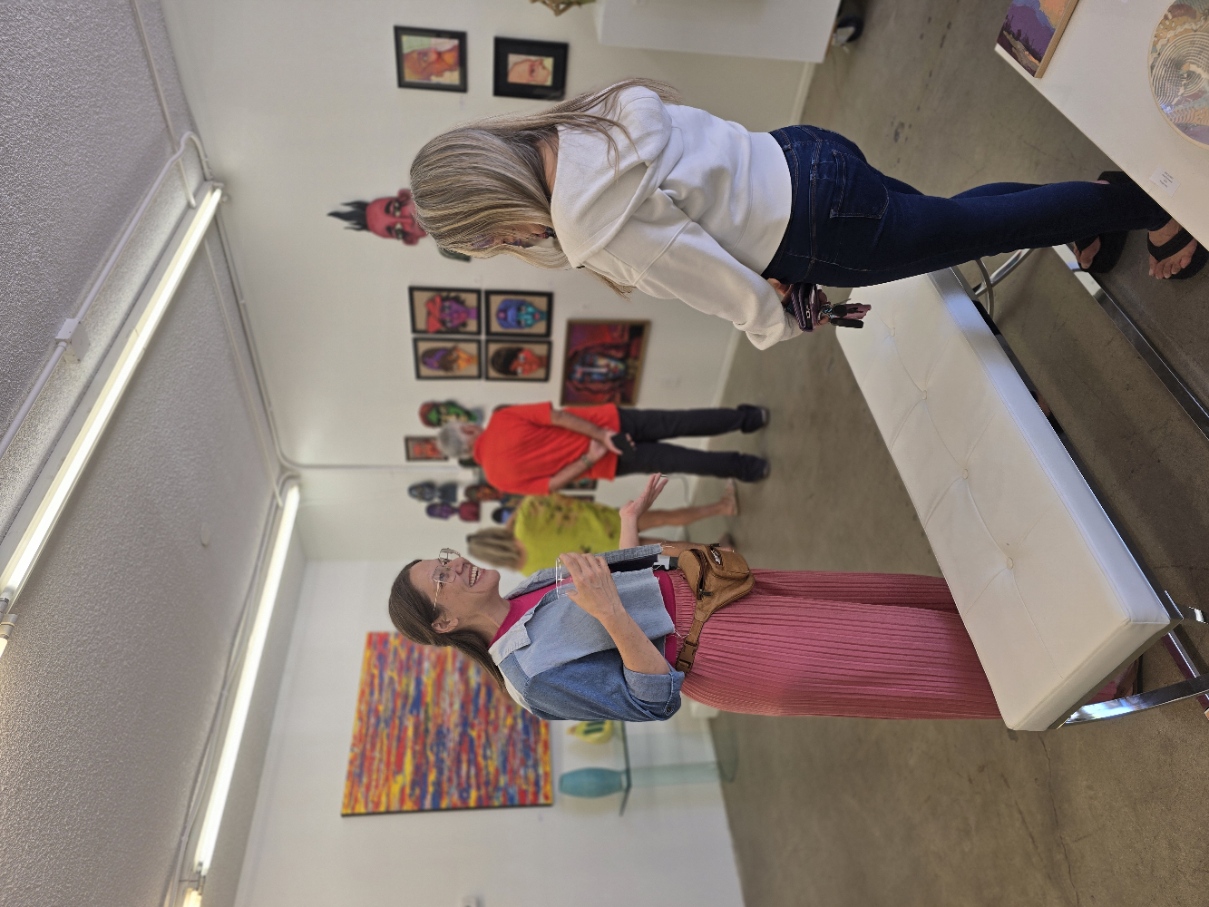 Visitors enjoying the gallery opening